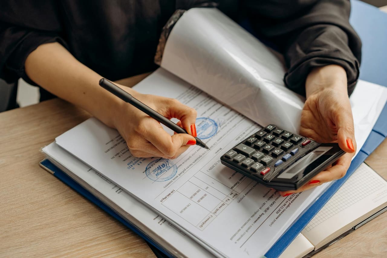 Italian SRL annual accounting and compliance documents on a desk